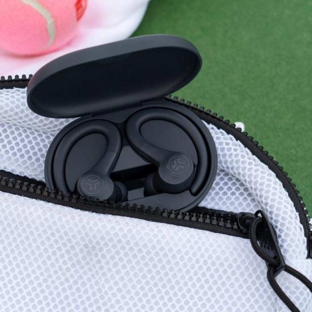 Black true wireless earbuds in open case, showing ear hooks and eartips