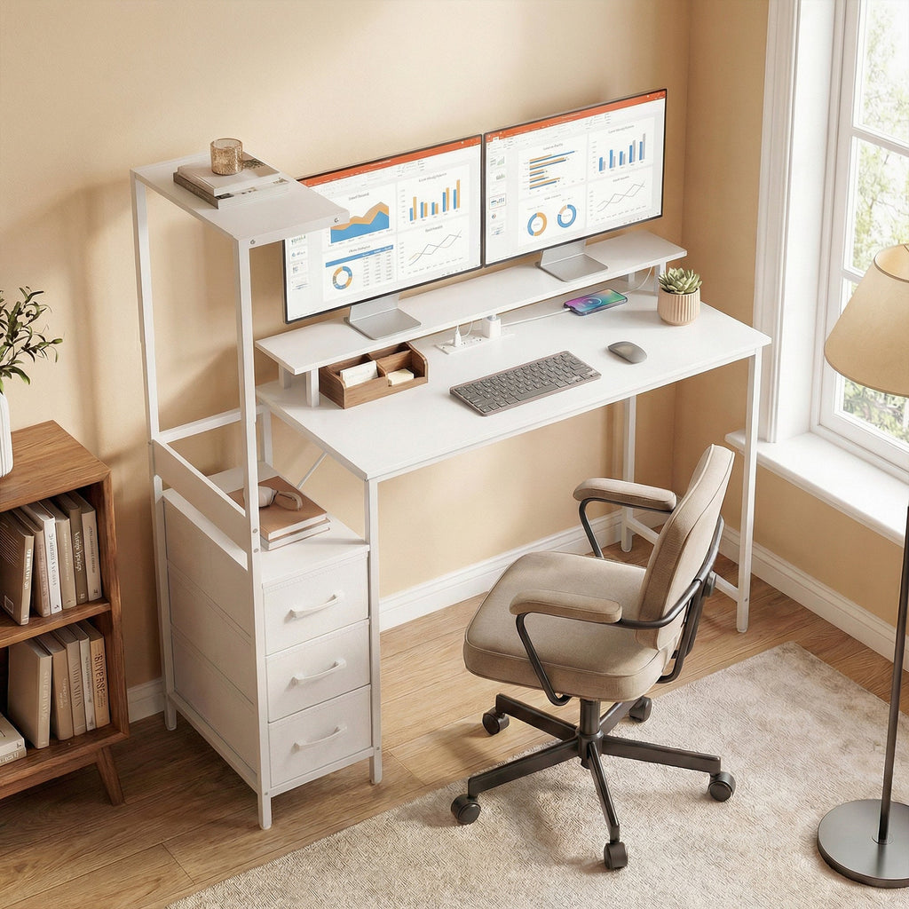 White computer desk with dual monitor setup, keyboard tray, drawers, and office chair