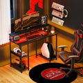 Grey computer desk with open shelves and under-desk LED light strip