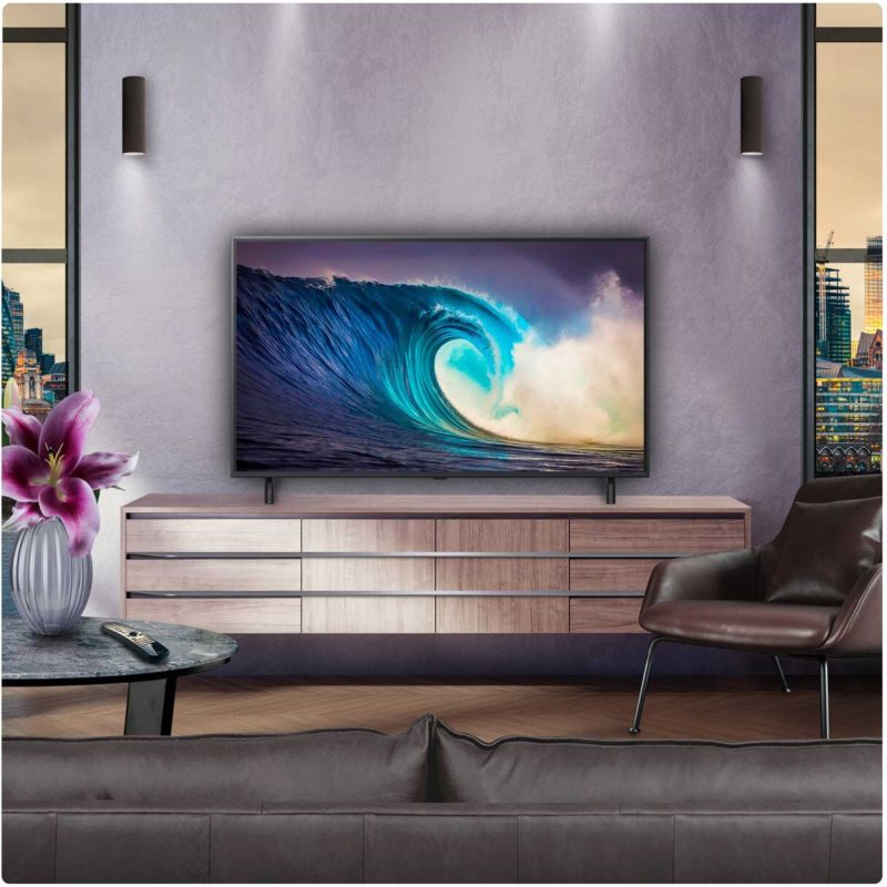 Wall-mounted smart TV with wave video display and slim dark bezel