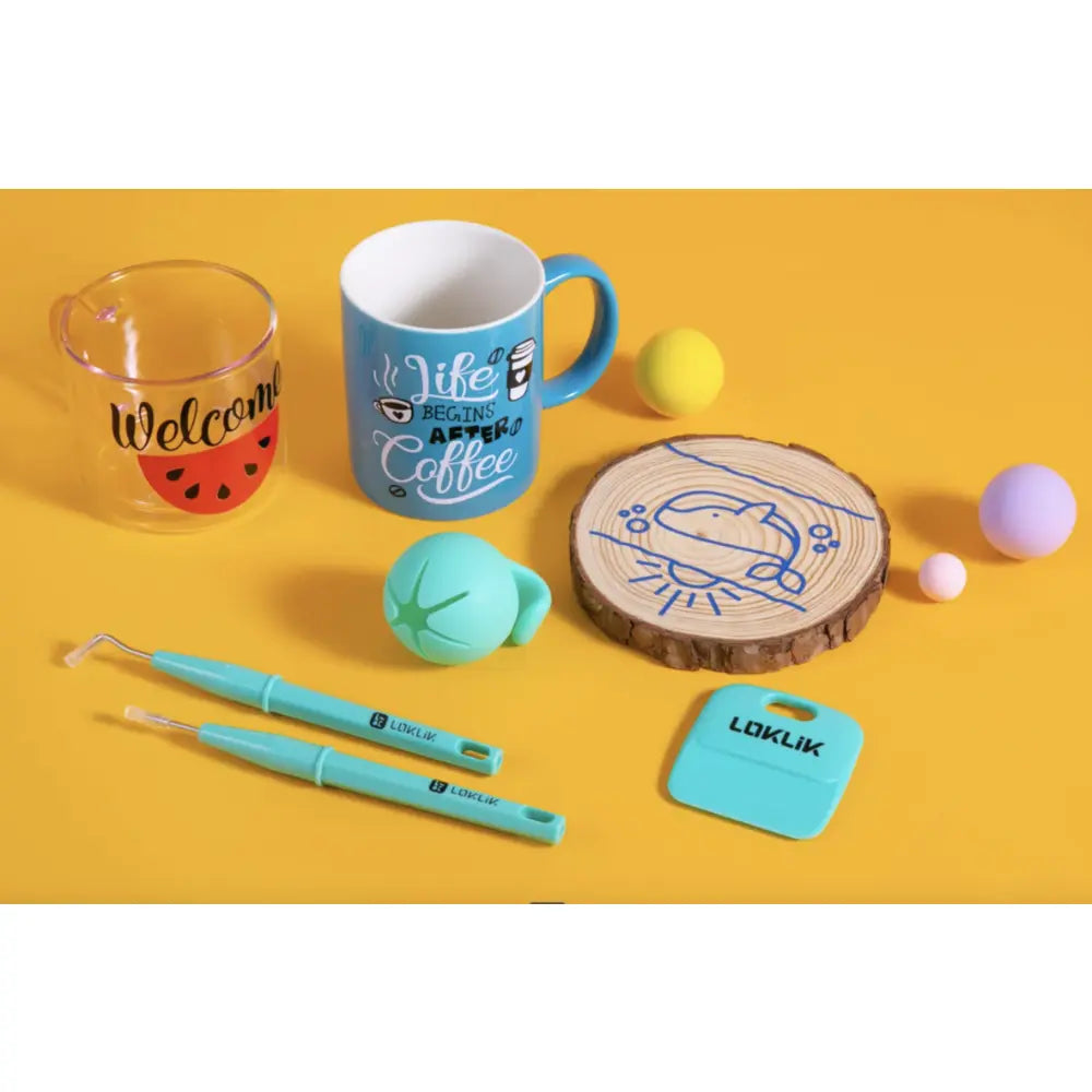 Craft starter pack items with mugs, coaster, and turquoise writing tools