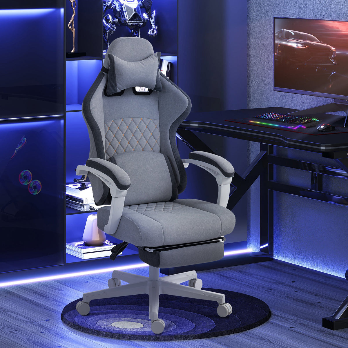 Grey high-back gaming chair with headrest, lumbar support, and reclining footrest