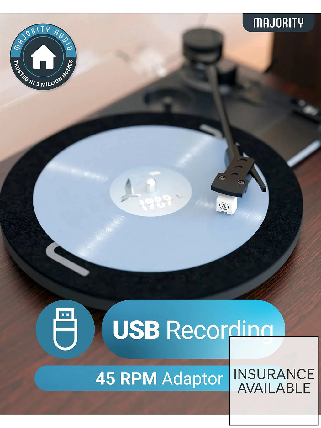 Turntable with vinyl record and USB recording adaptor near tonearm