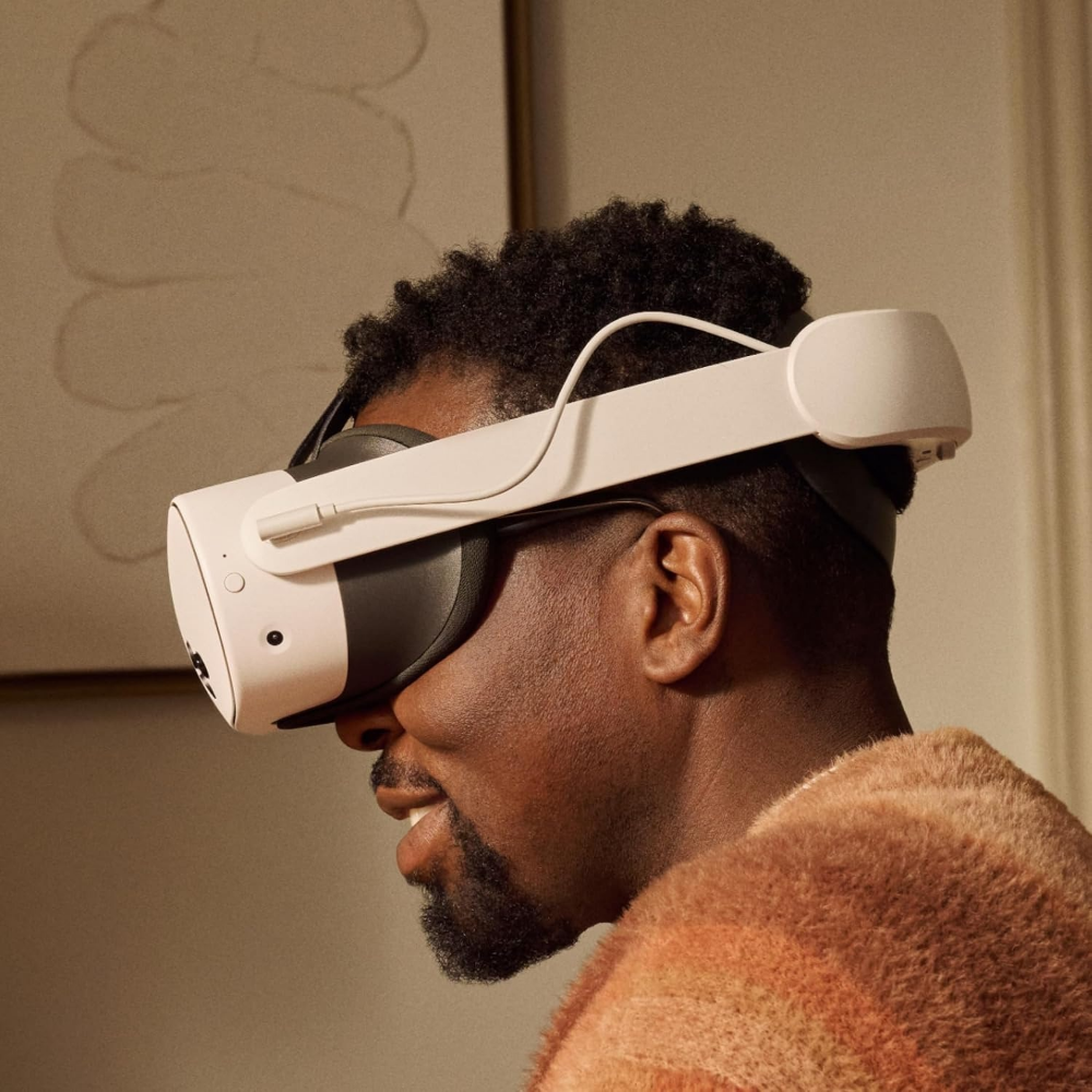 White VR headset on person with black strap and white side padding