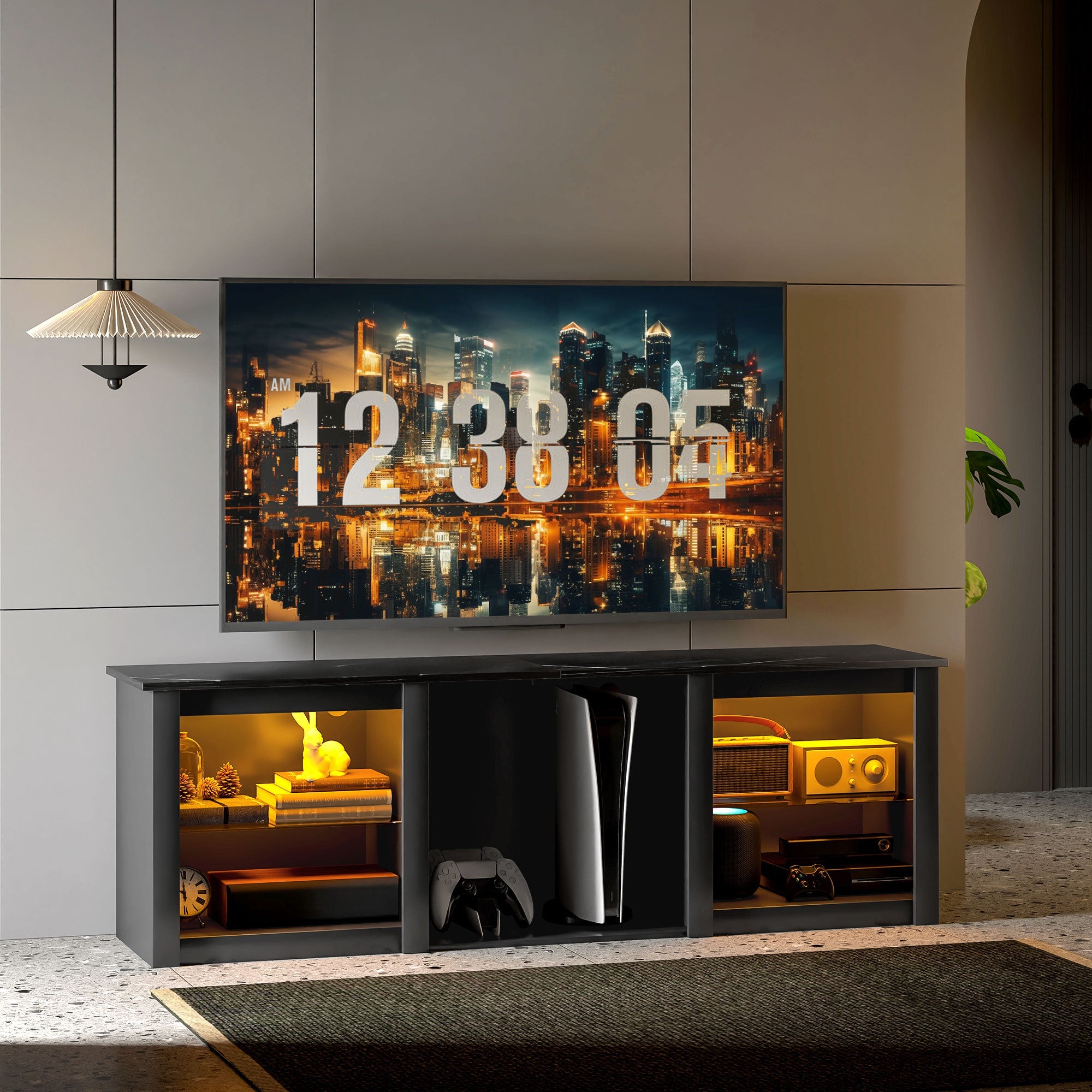 Black TV console cabinet with open shelves and LED accents beneath a wall-mounted TV