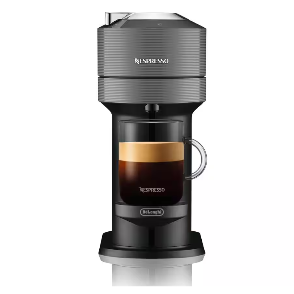 NESPRESSO Vertuo Next coffee and milk machine, front view with cup under spout