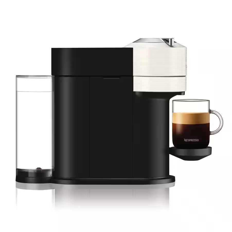 Nespresso Vertuo Next coffee machine with milk frother, white top, cup on drip tray