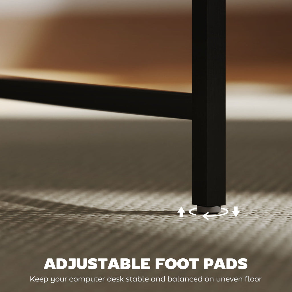 Adjustable foot pads under a black metal computer desk frame for uneven floors