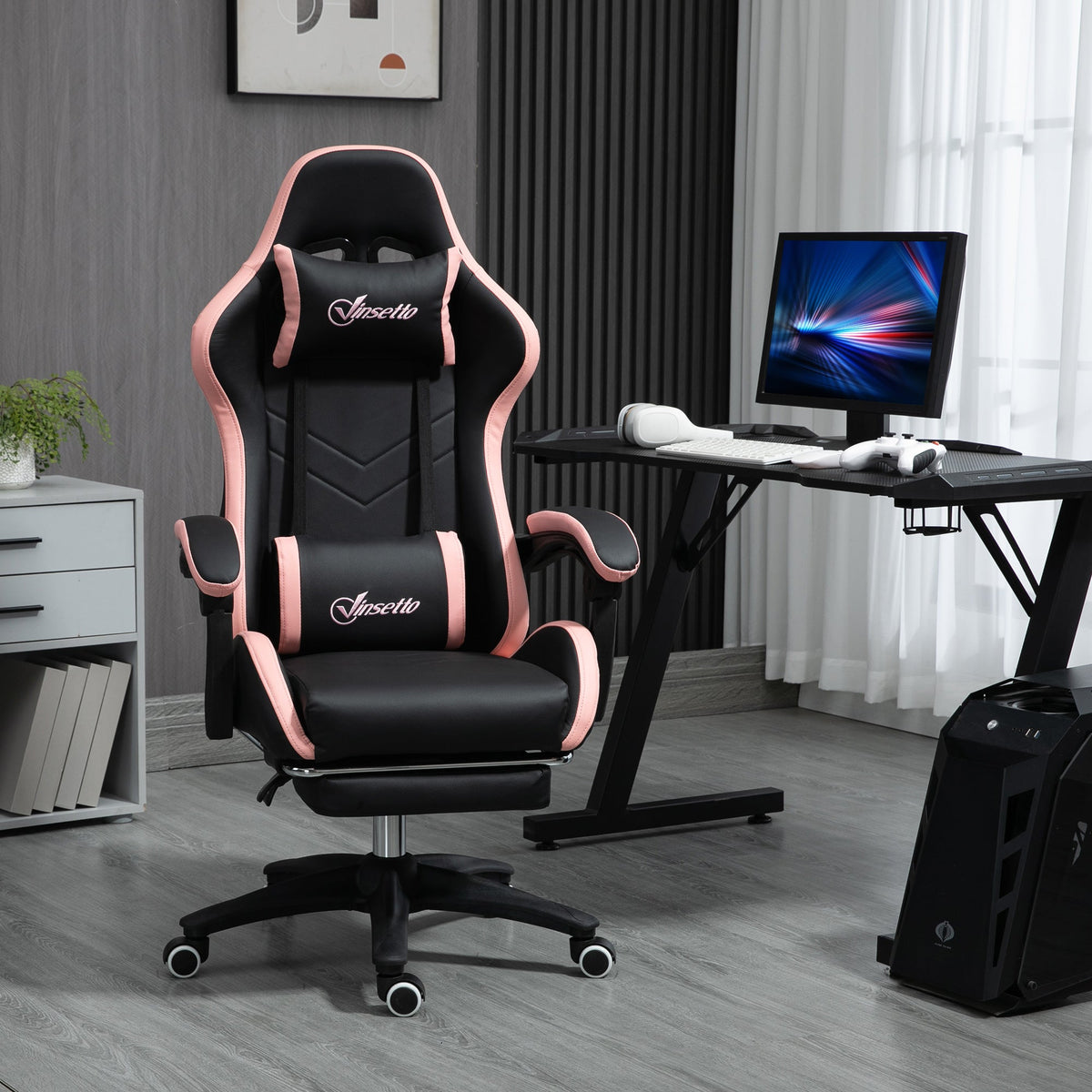 Gaming chair with black PU leather seat, pink trim, armrests, and swivel base with wheels