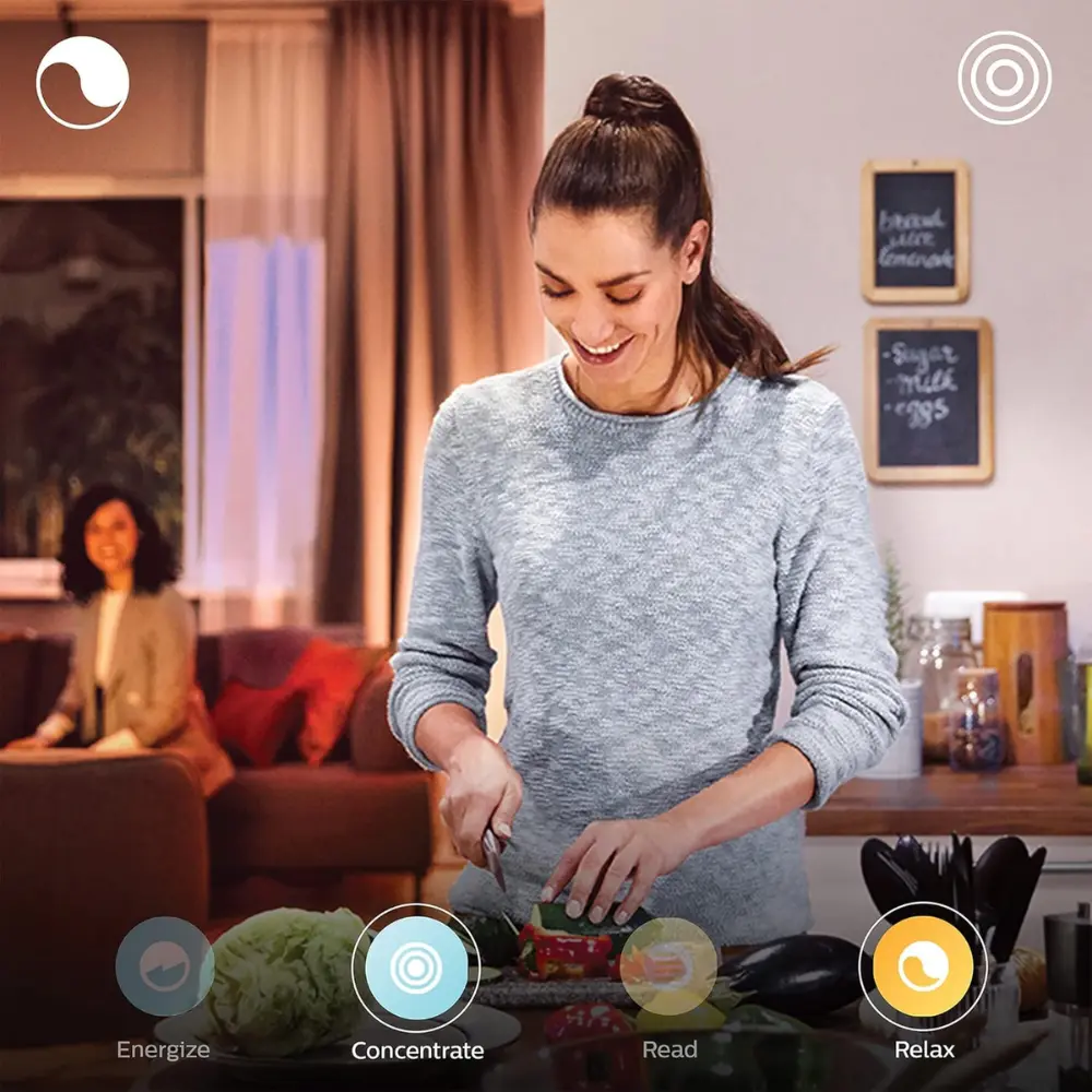 Philips Hue smart lighting app scene, woman using connected light controls