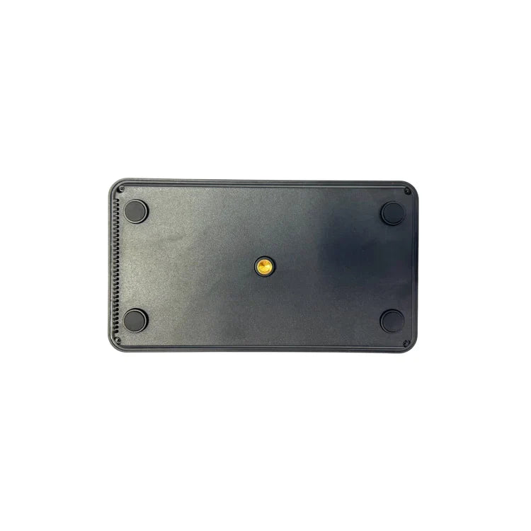 Underside of portable DLP LED projector with four corner feet and central yellow screw