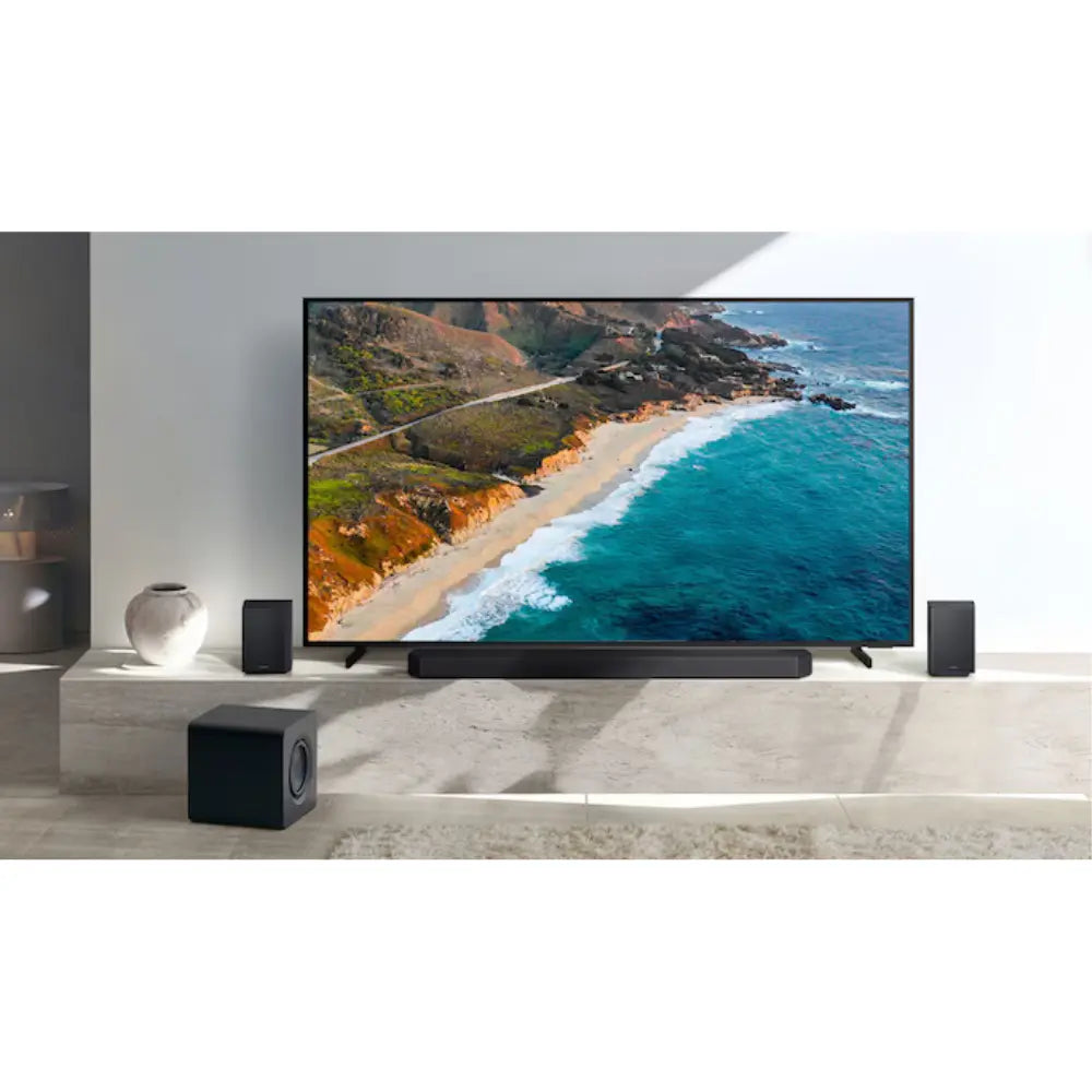 Black soundbar system with subwoofer and cube surround speakers