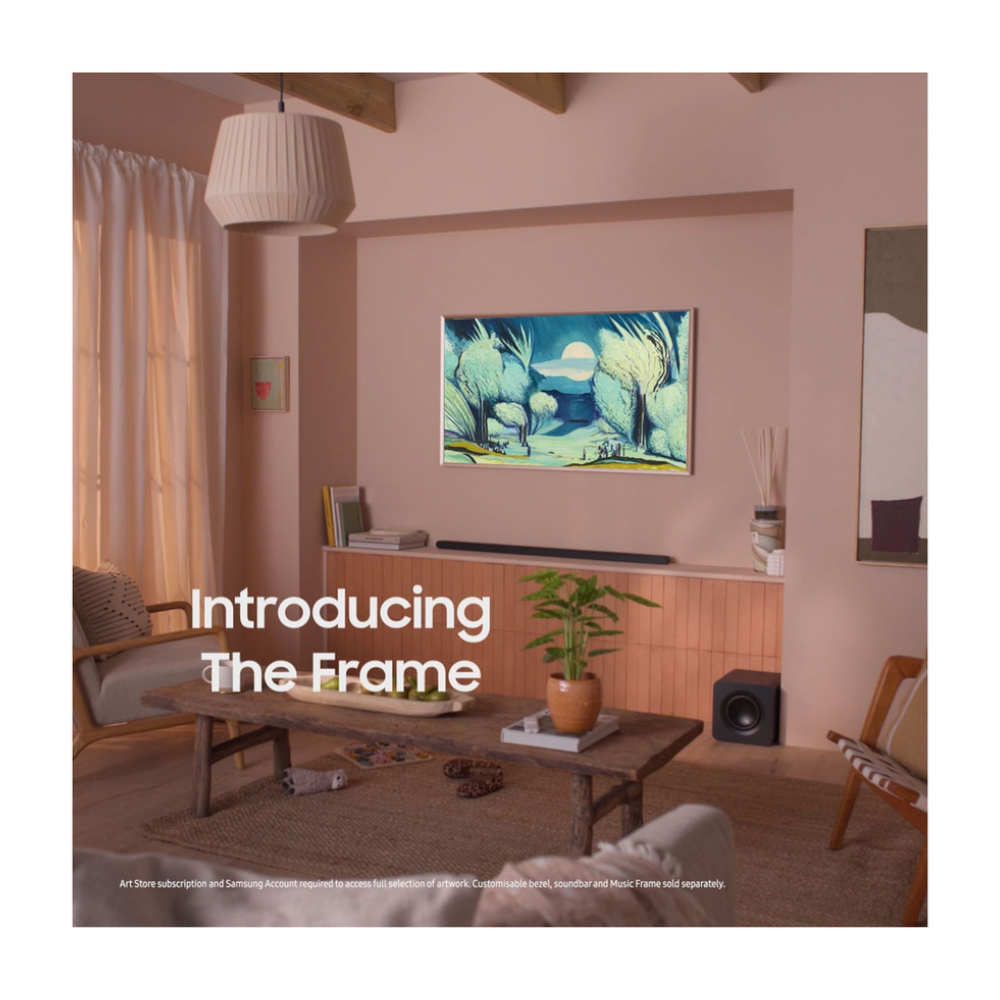 50-inch QLED AI TV mounted on wall, slim black frame in living room