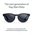 Shiny black smart sunglasses with dark round lenses and curved arms
