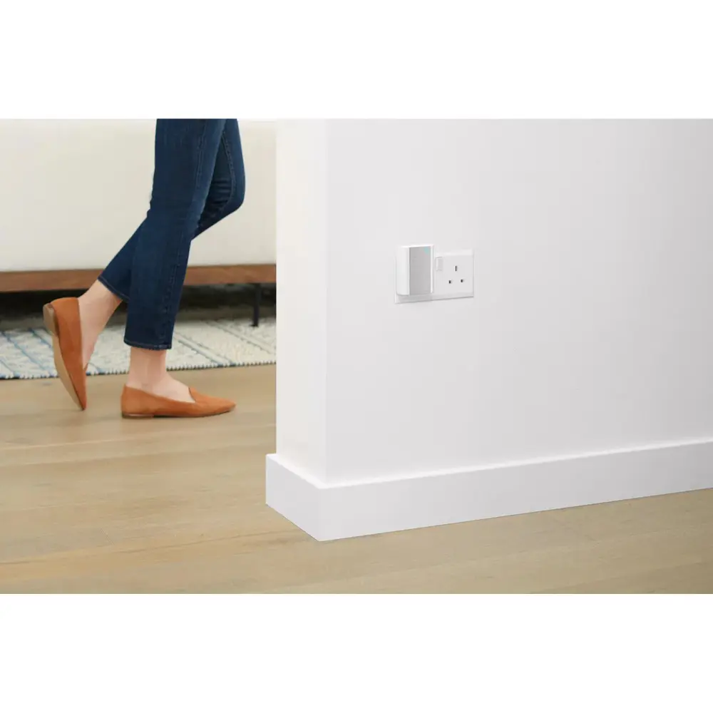 Ring smart chime plugged into wall outlet, small white device
