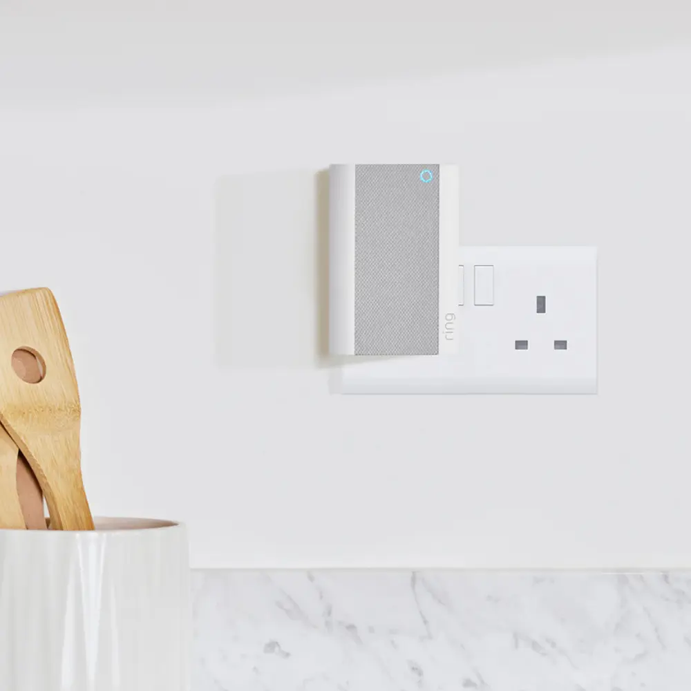 White chime pro speaker with ring logo, mounted near front door