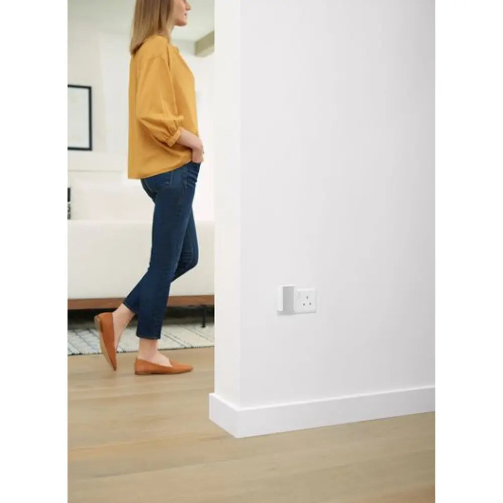 Wall-mounted smart chime on the wall near an electrical outlet