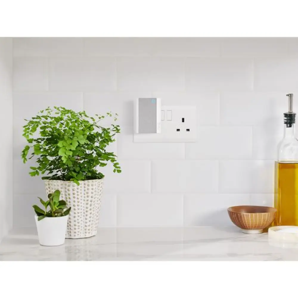 Ring Chime (2nd Gen) wall chime with blue indicator light on white wall
