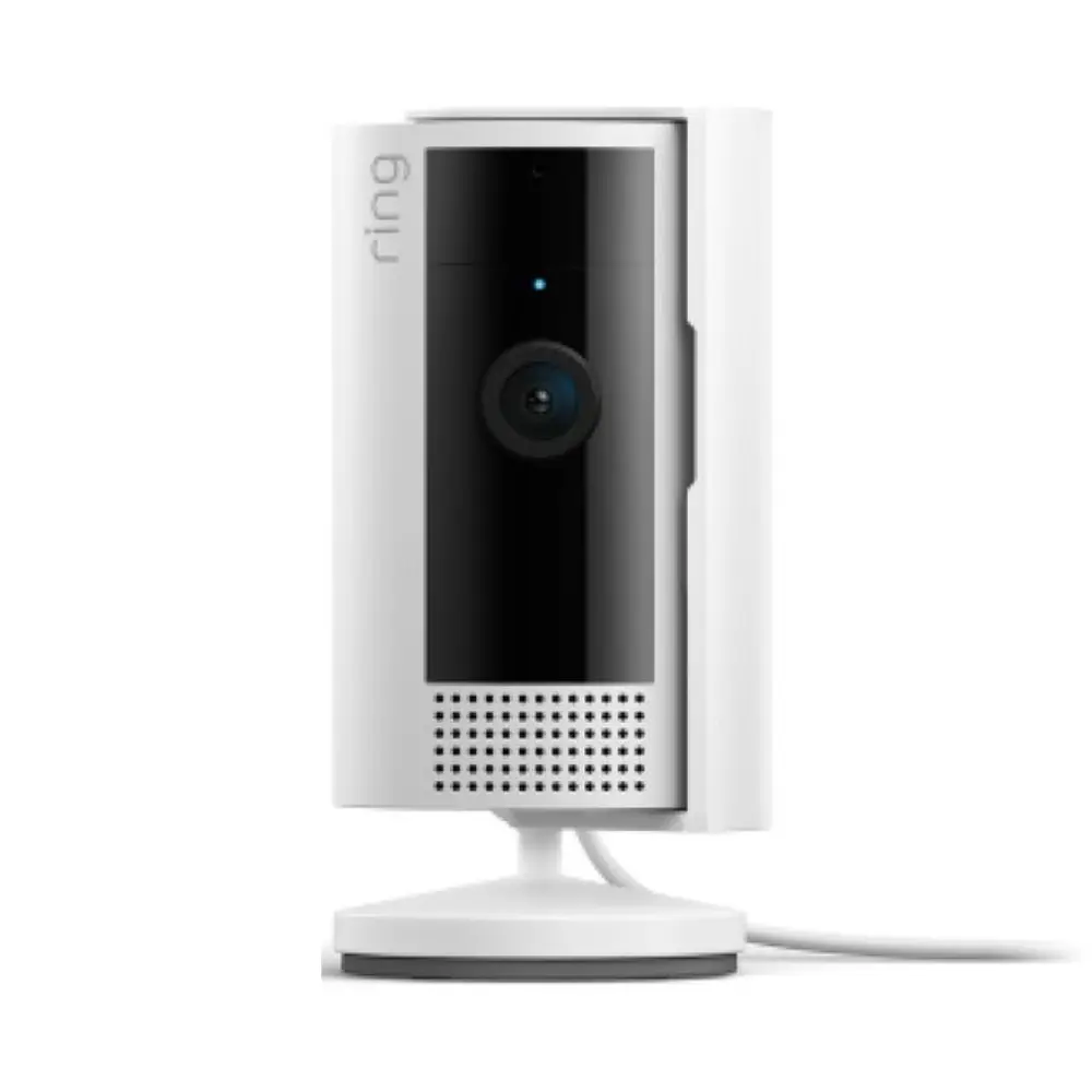 Indoor security camera close-up, white housing, front lens and speaker grille