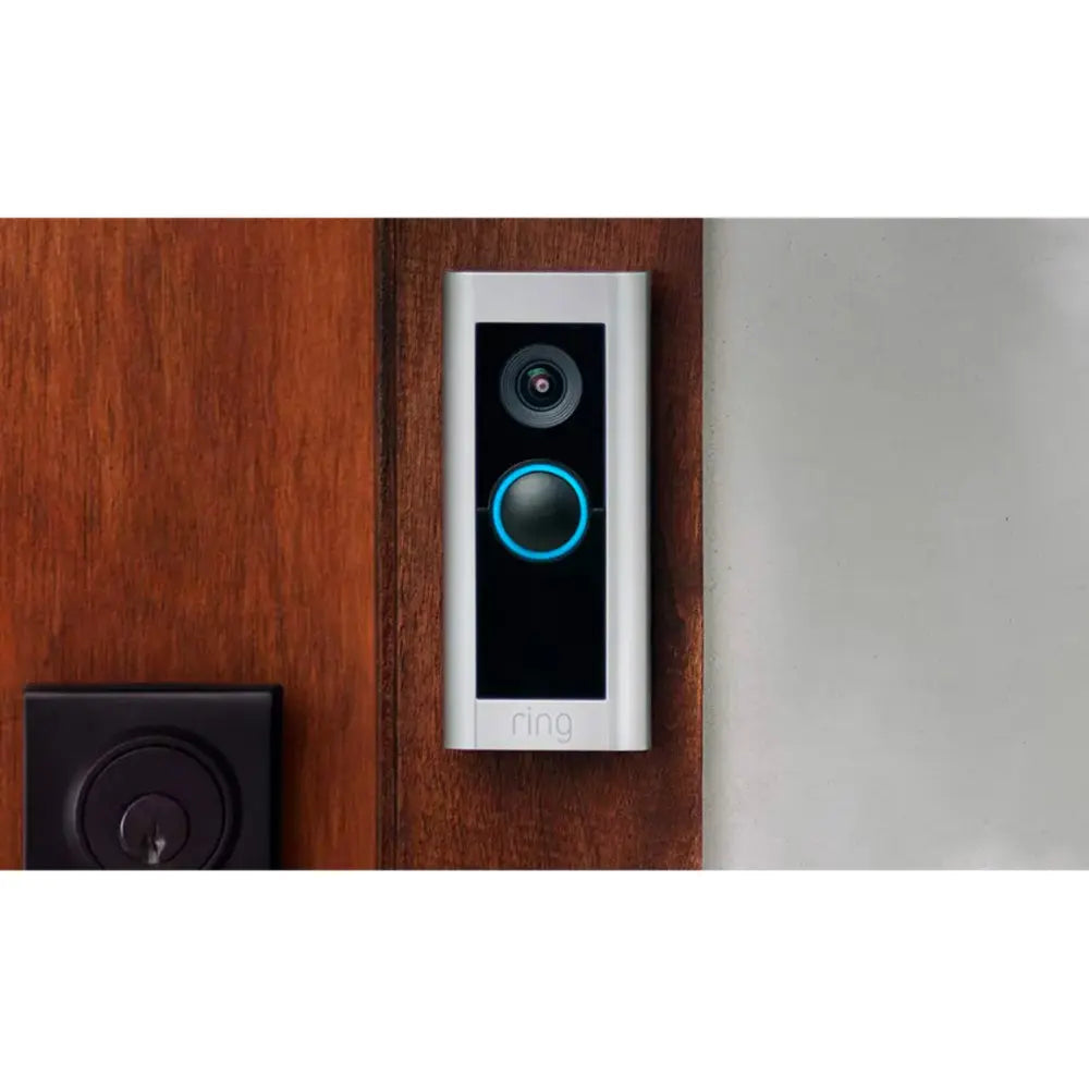 Silver plug-in smart doorbell with camera and glowing blue ring, wall-mounted