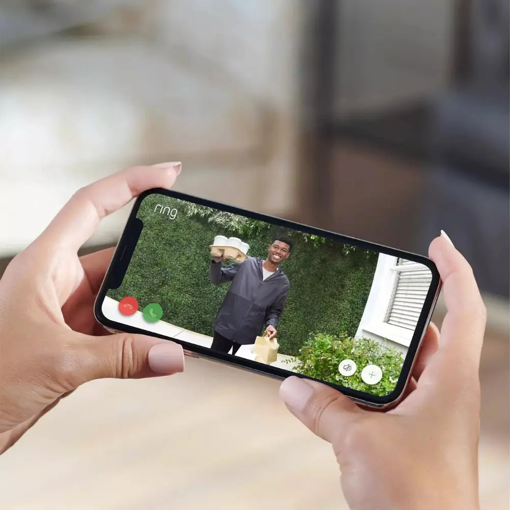 Smartphone showing live video from a doorbell with call and notification icons