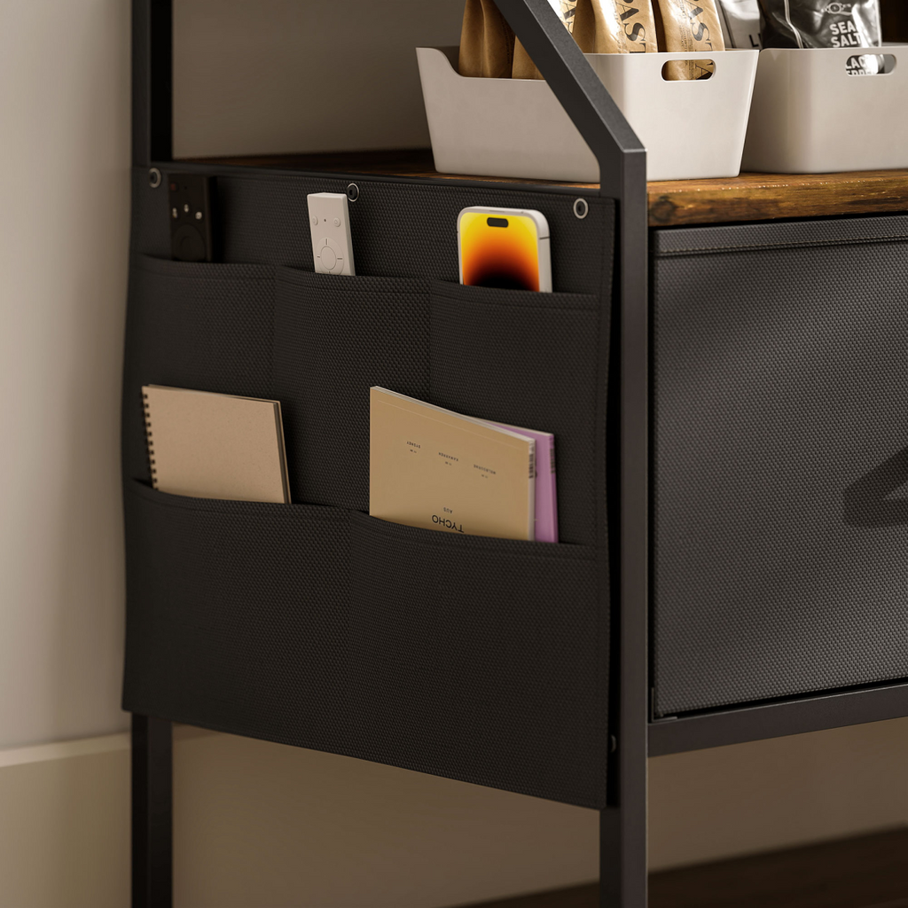 Close-up of foldable drawer interior with fabric storage pockets and paper items