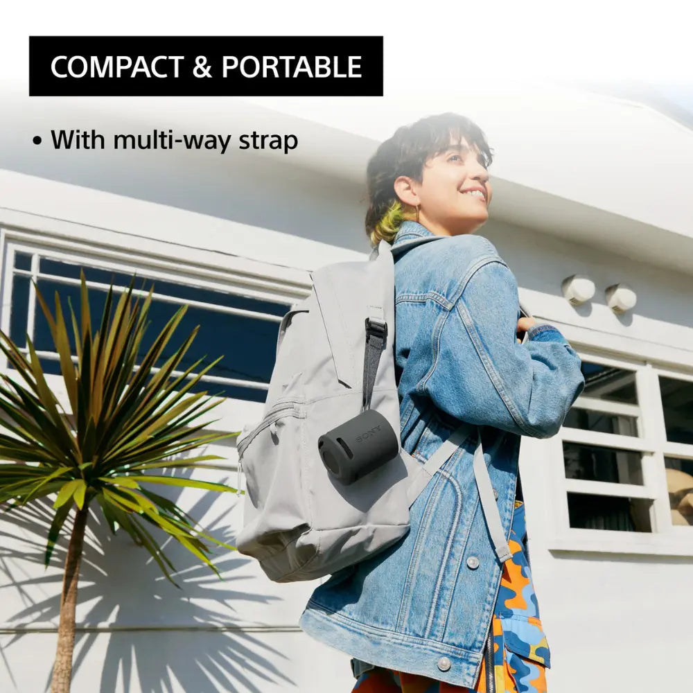 Orange SONY wireless Bluetooth speaker with carry strap, compact portable design