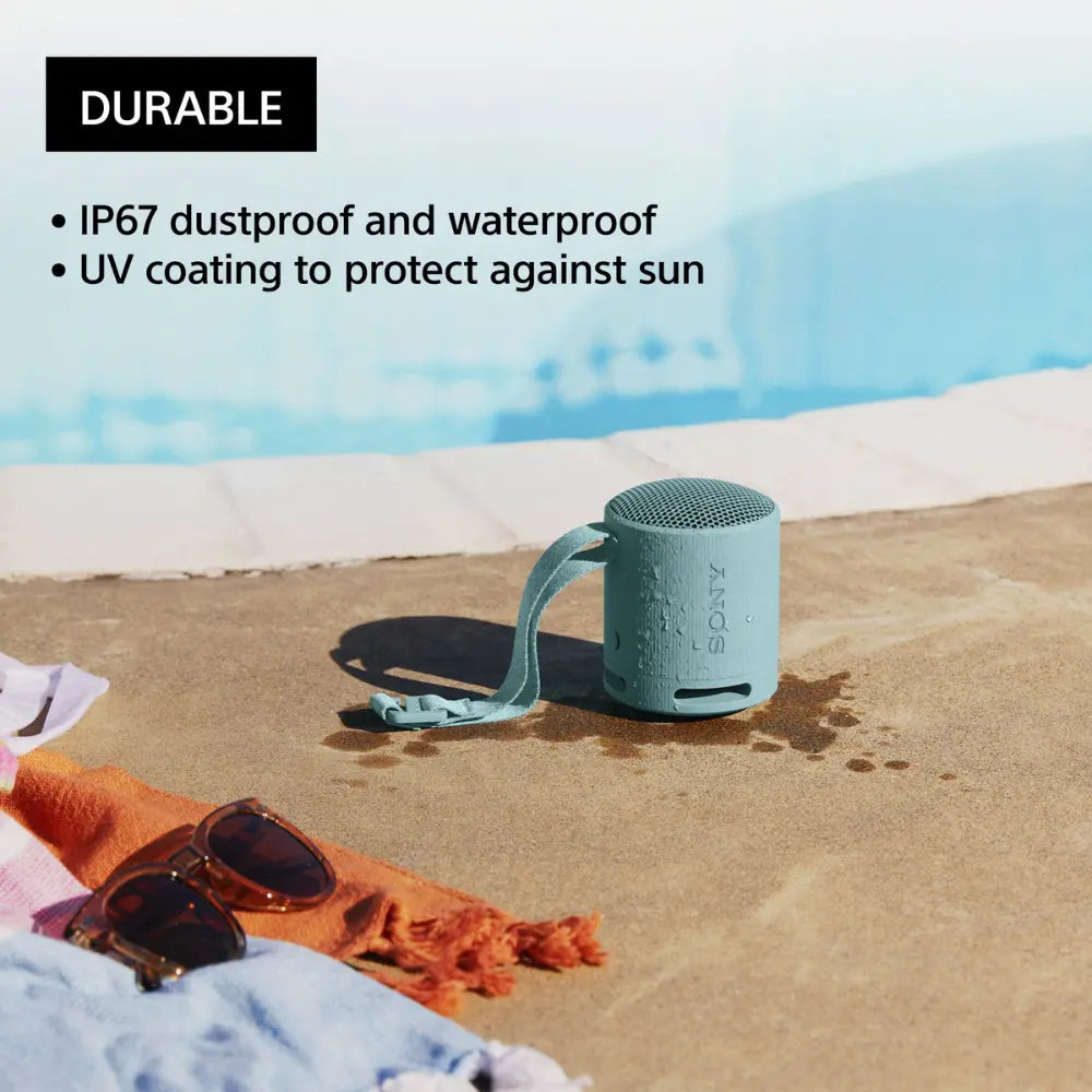 Teal SONY wireless Bluetooth speaker on outdoor ground