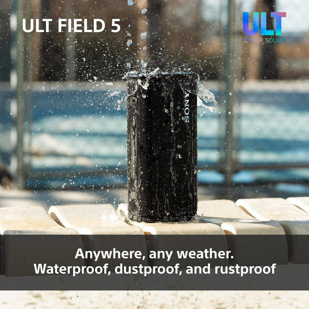 Water-splashed black SONY portable speaker with LED ring and textured fabric grille.