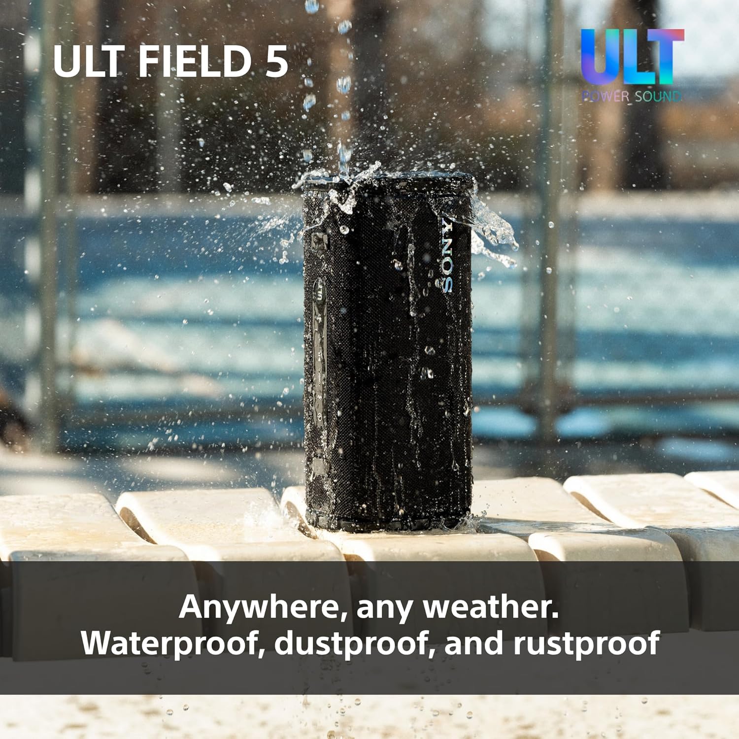 Water-splashed black SONY portable speaker with LED ring and textured fabric grille.