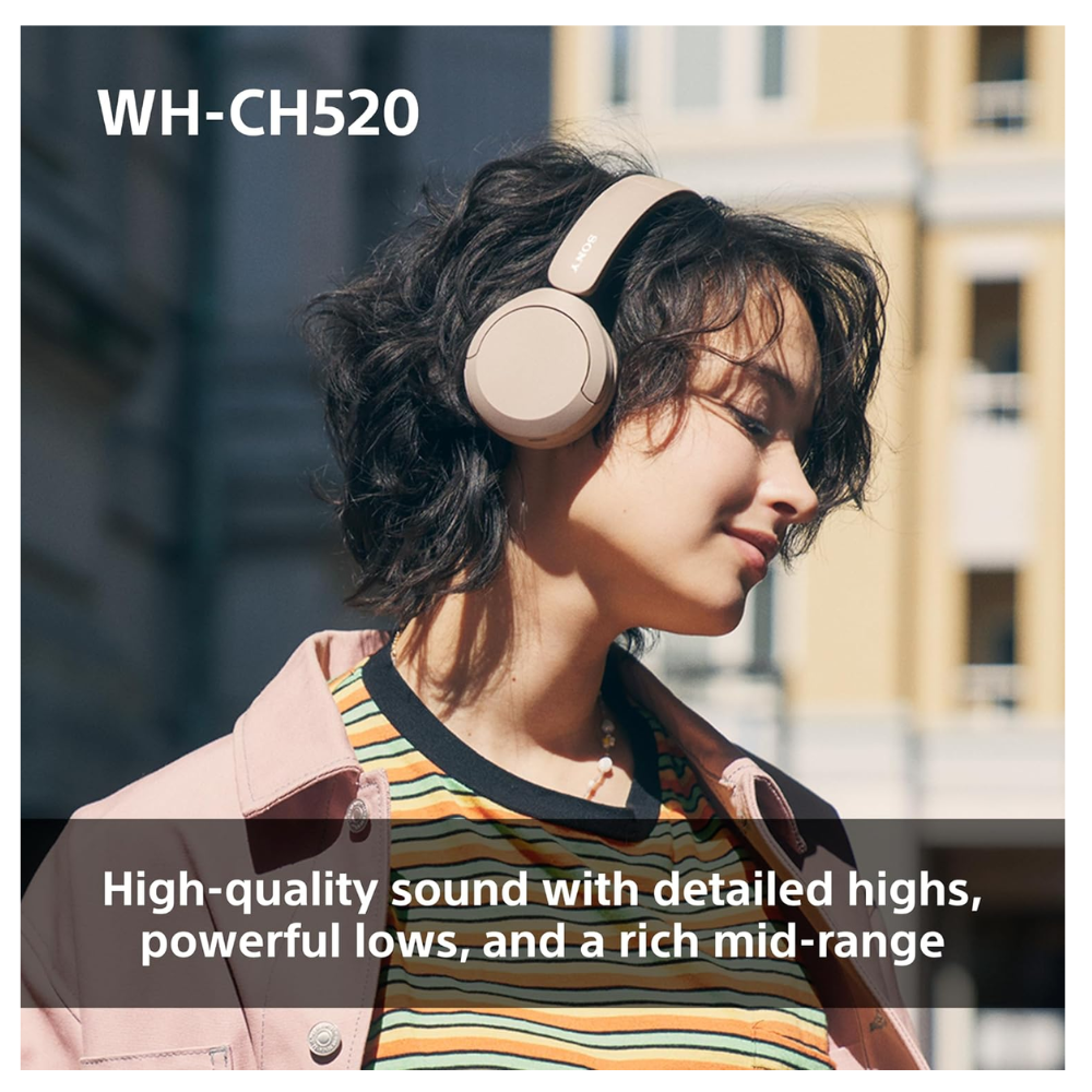 Black over-ear wireless Bluetooth headphones worn over ears by person