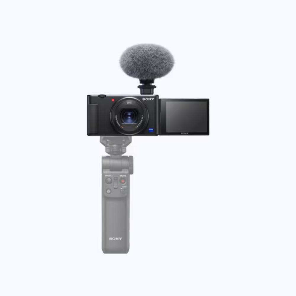 Vlog digital camera with foam windscreen mic, flip screen, and handheld grip