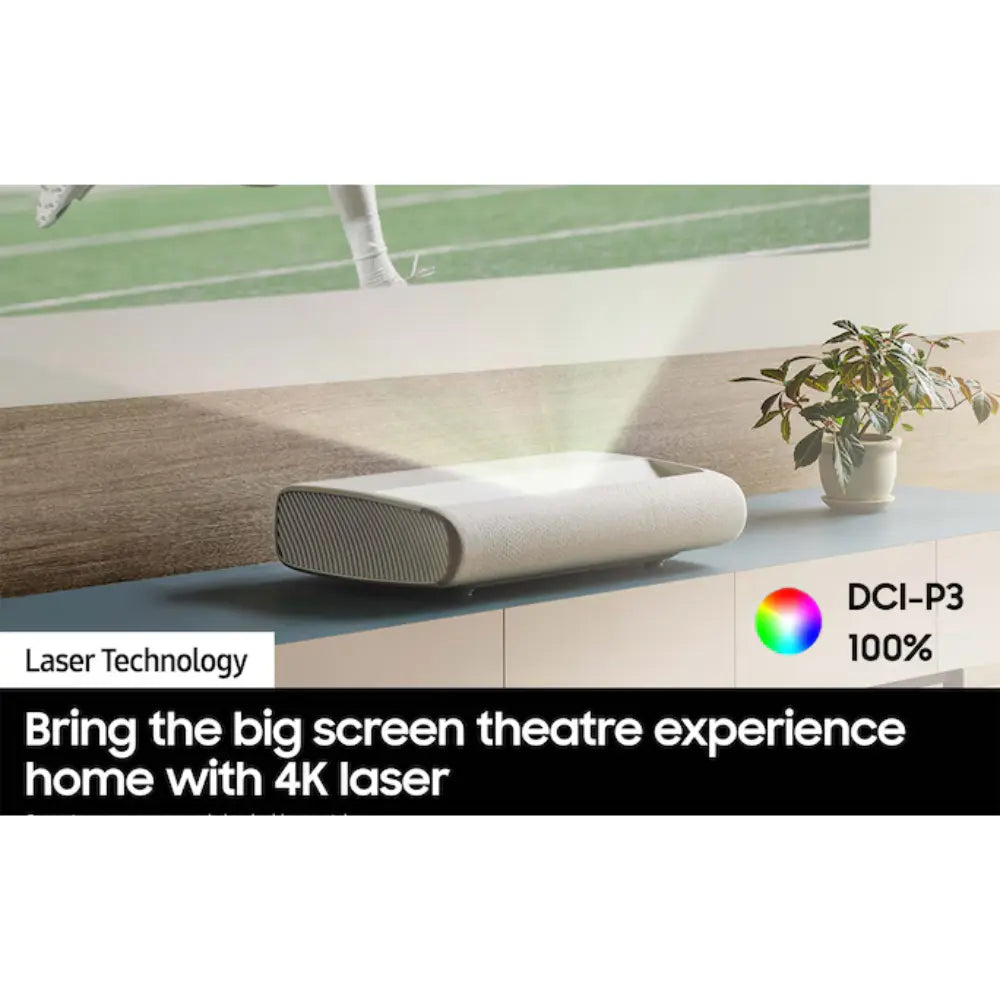 Compact dark-gray and white laser projector on a console shelf, front speaker grille
