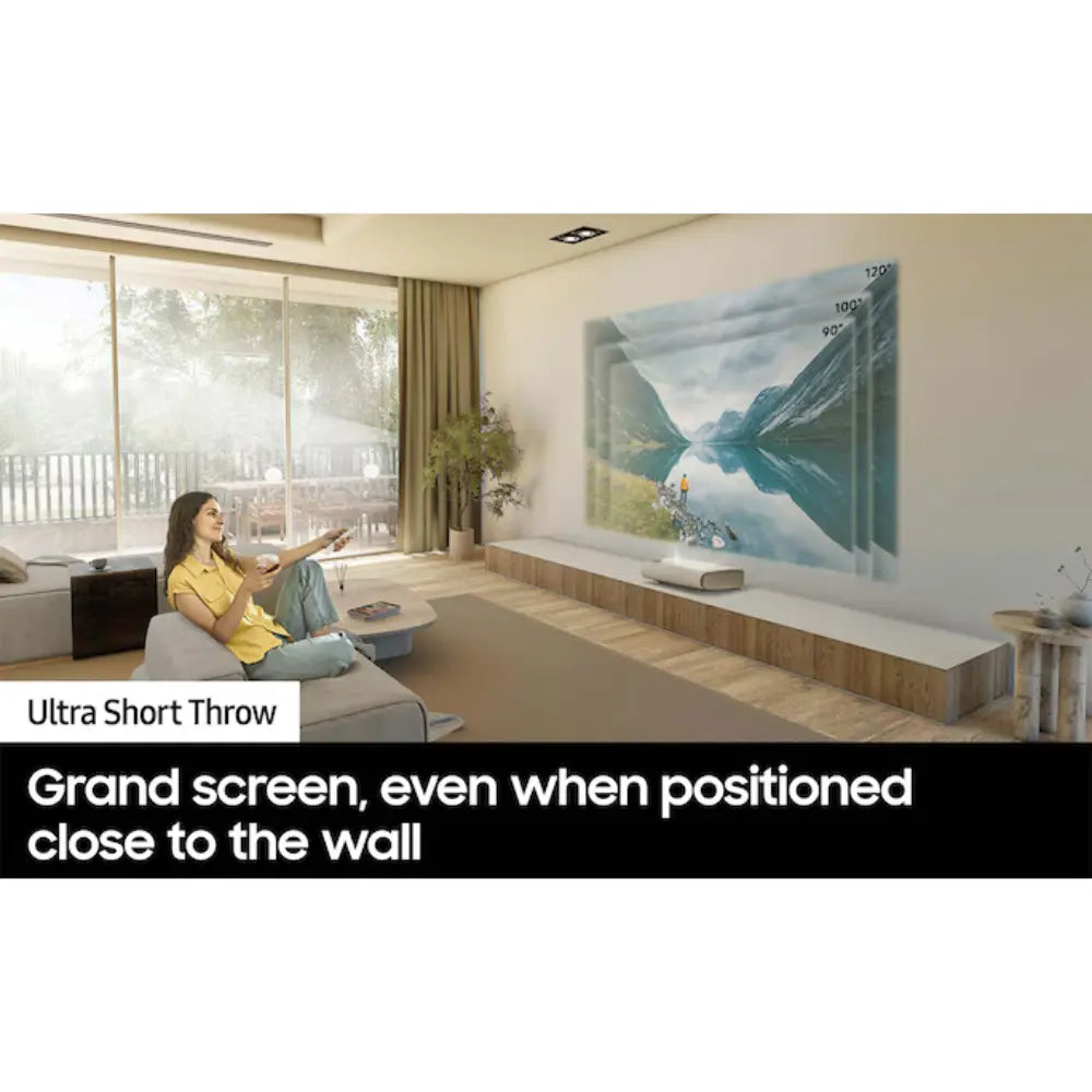 Ultra short throw laser projector on a media console facing a wall screen