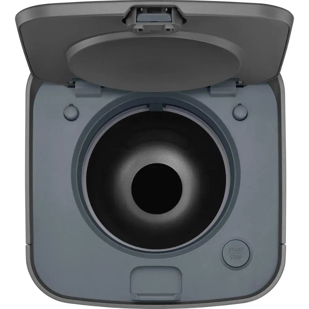 Close-up of grey cleaning station top opening with circular intake and control buttons