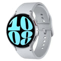 Silver smartwatch with blue digital watch face and light gray silicone wrist strap
