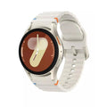 Cream smartwatch with round display, silver case, and white silicone band