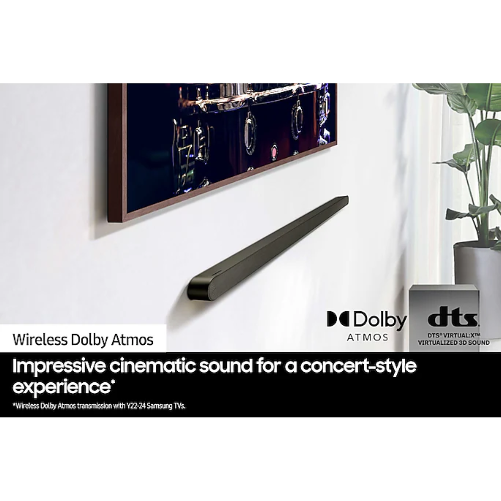 Slim black sound bar mounted on wall with Dolby and DTS logo marks
