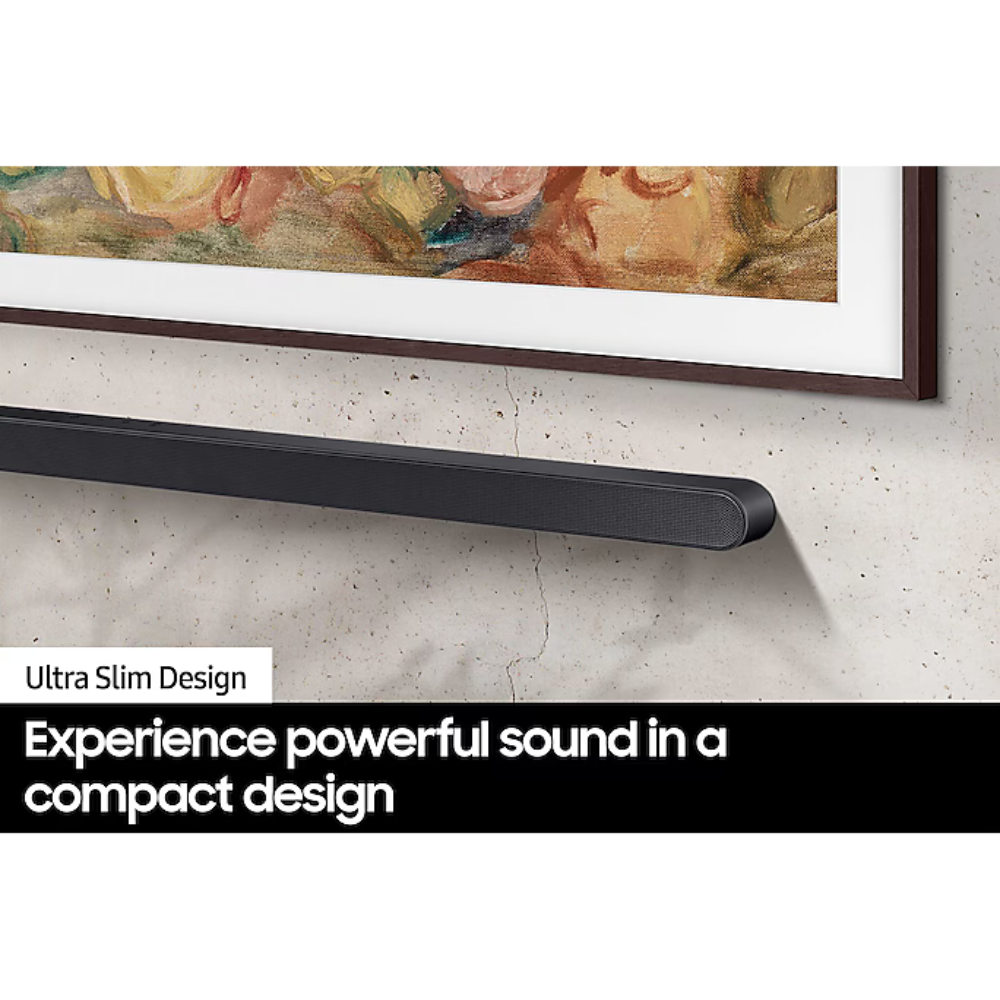 Ultra-slim black sound bar on wall under artwork