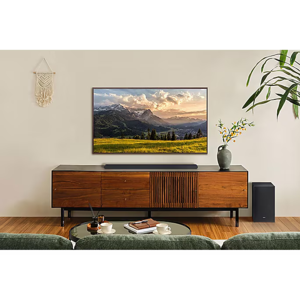 Sound bar on TV console with matching wireless subwoofer speaker