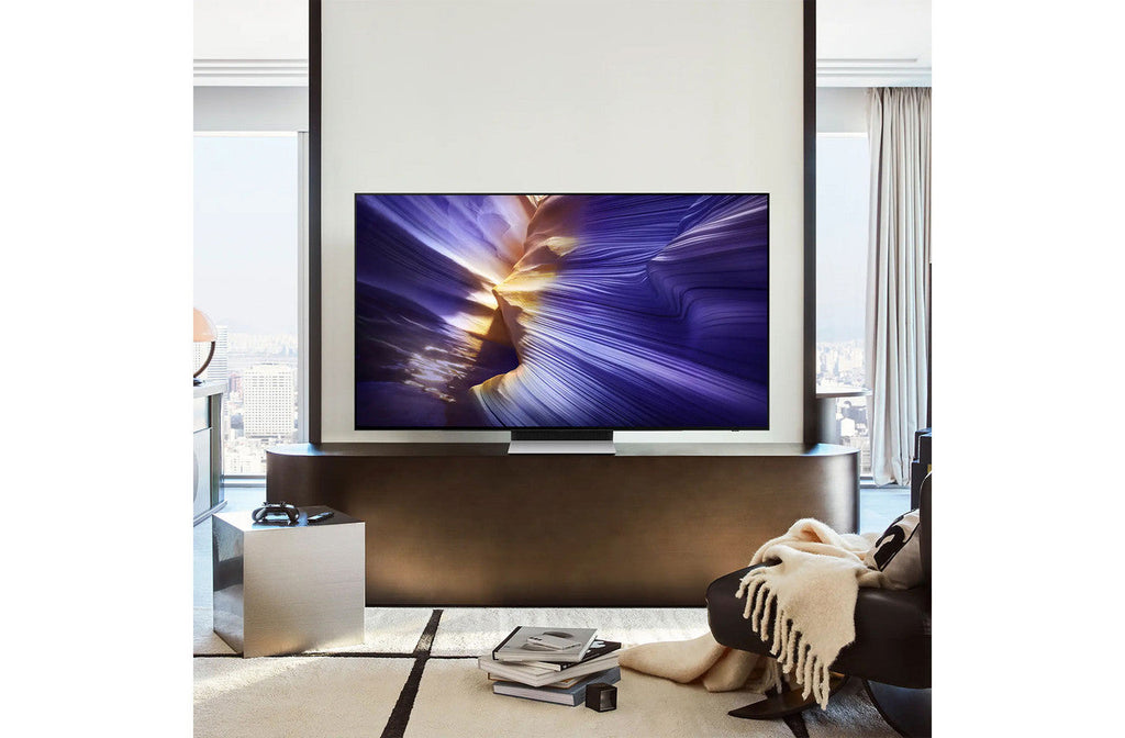 Samsung 42 inch OLED 4K smart TV on two stands, showing content on screen