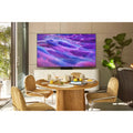Samsung TV with vibrant purple-blue screen and slim bezel