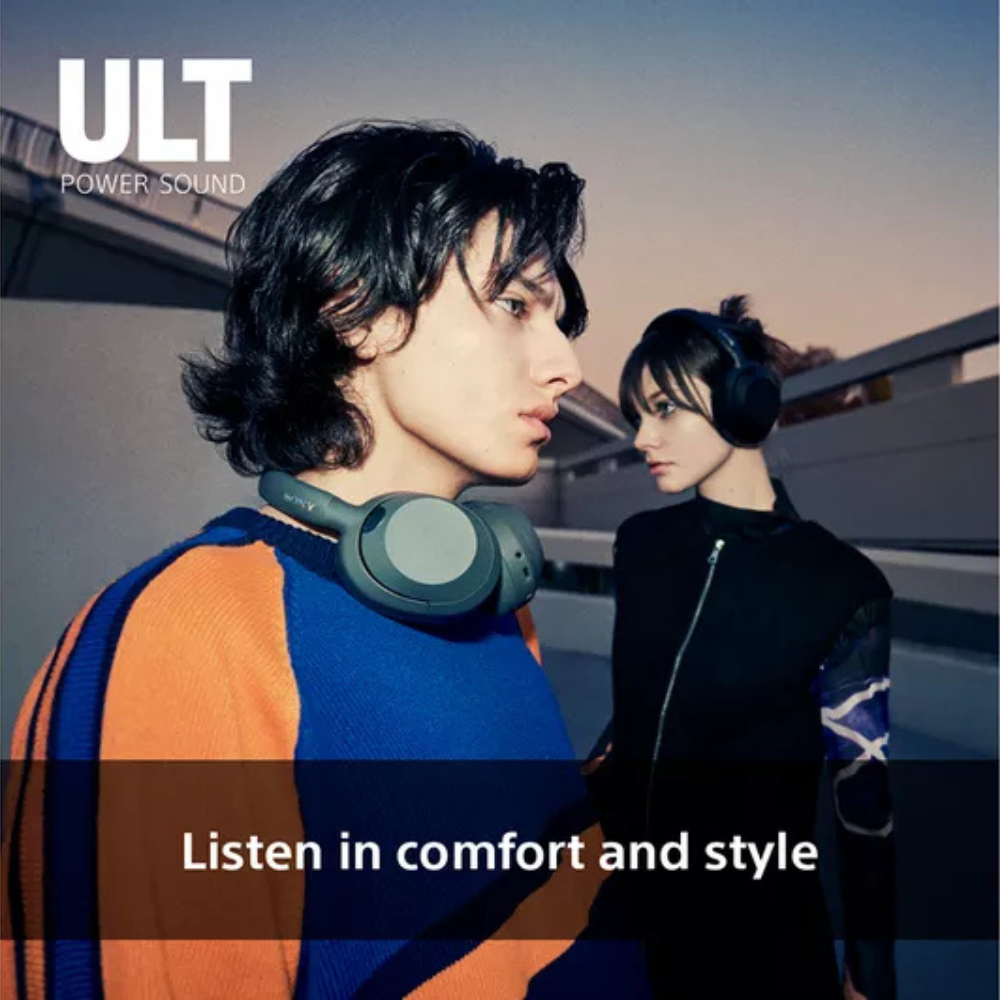 Over-ear wireless headphones worn by a person, dark color with padded earcups