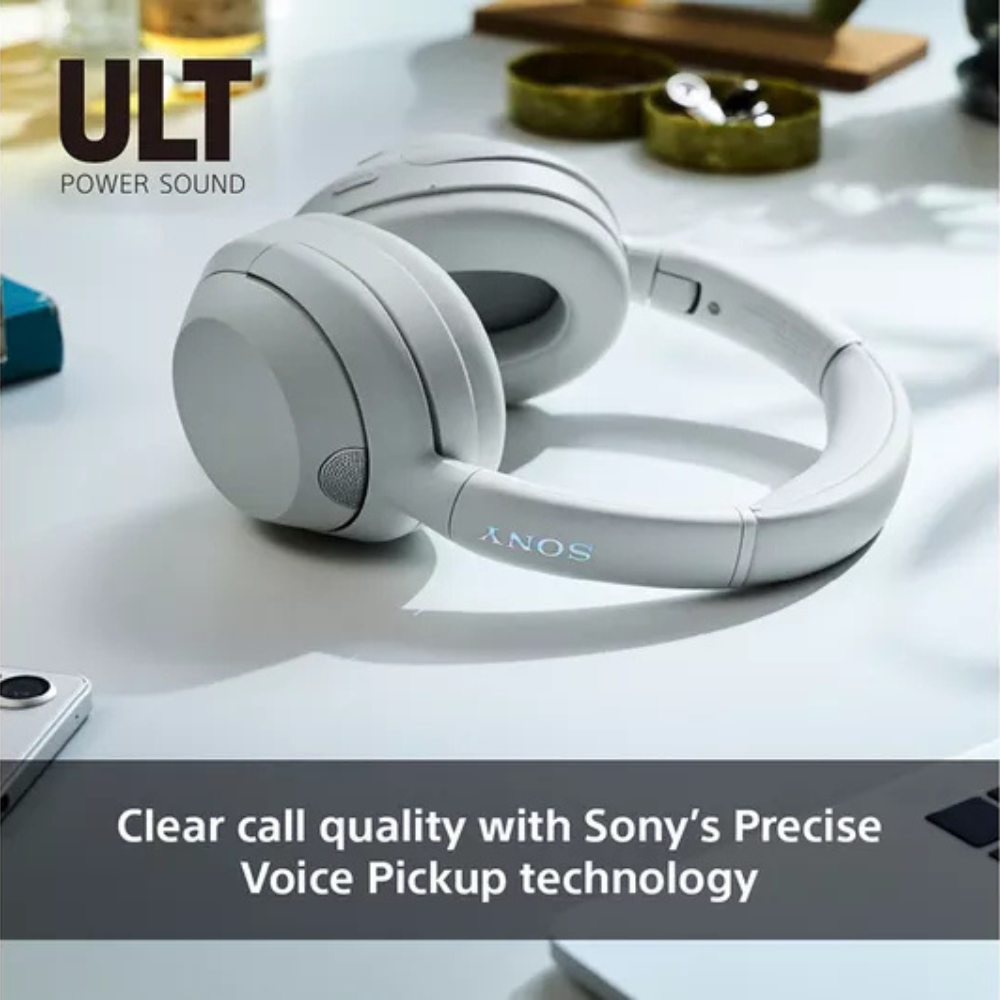 White over-ear wireless headphones close-up with cushioned headband