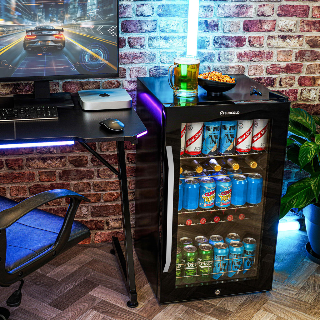 Compact black beer fridge with glass door, neatly arranged cans and bottles inside