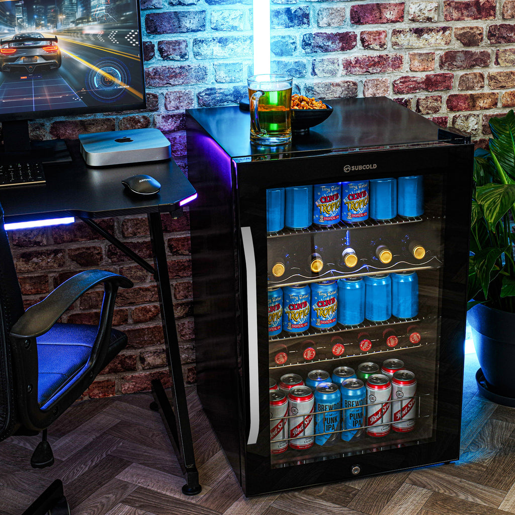 Black LED beer fridge with glass door, lit shelves of assorted cans