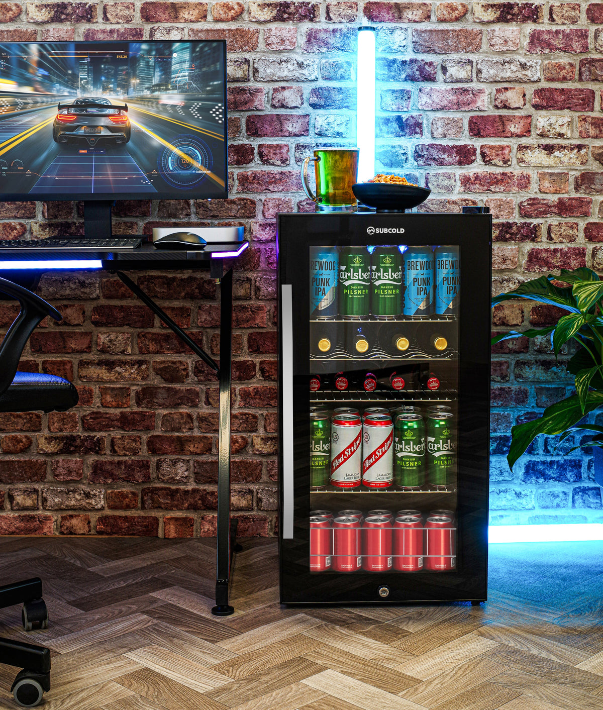 Black freestanding beer fridge with illuminated interior display and glass door