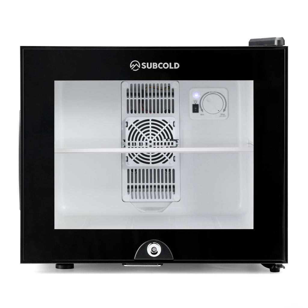 Mini fridge interior view with cooling fan vents and temperature control dial