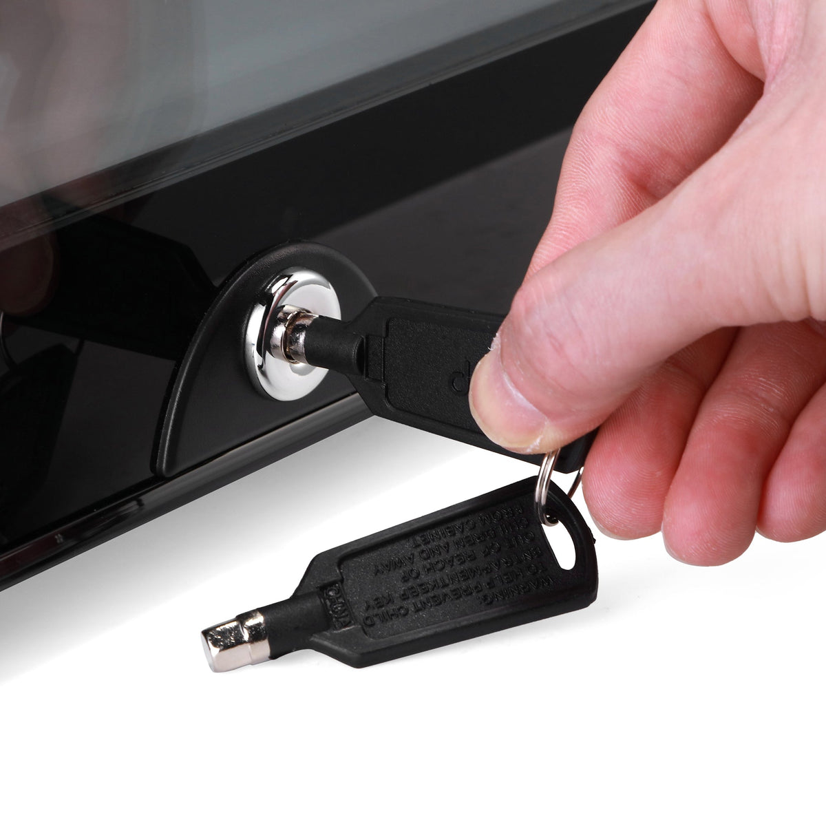 Mini refrigerator key lock with metal key held near the latch