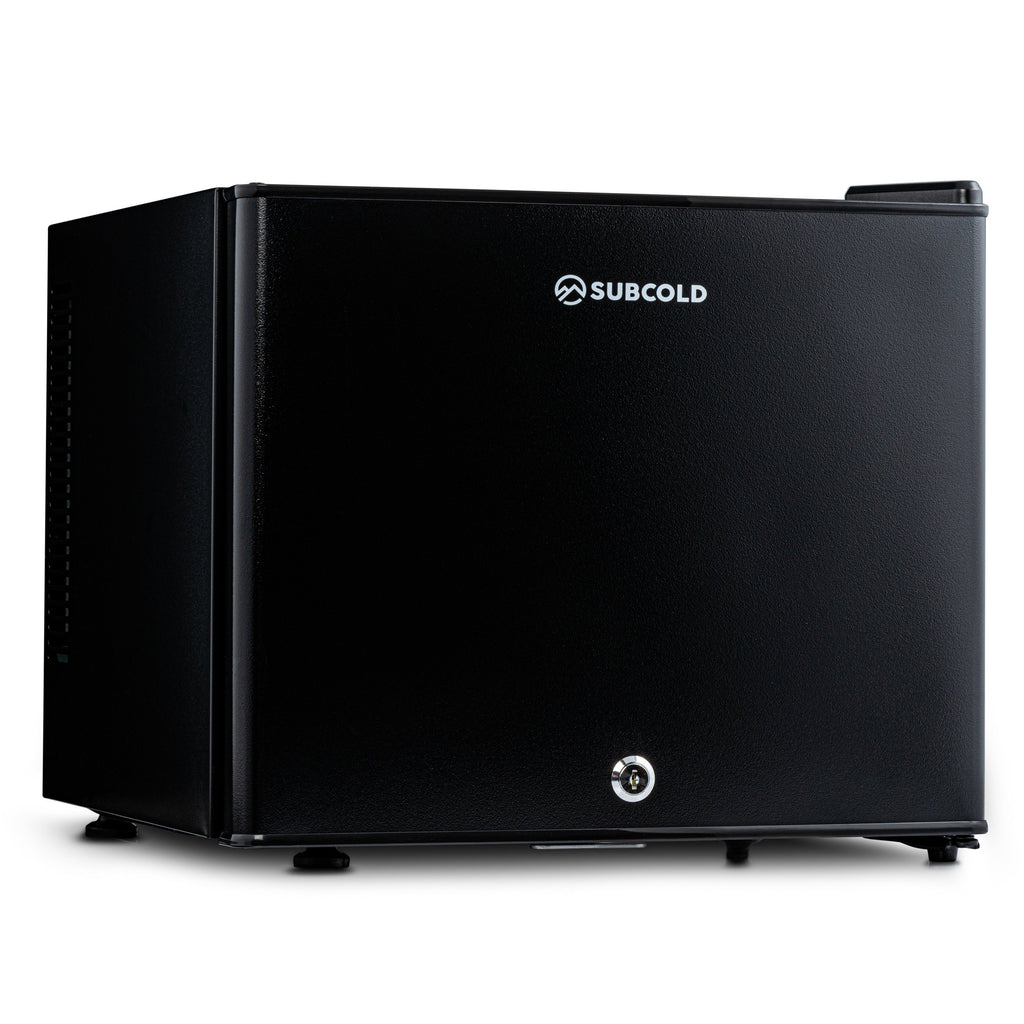 Black mini fridge with SUBCOLD logo, front door closed and caster feet visible